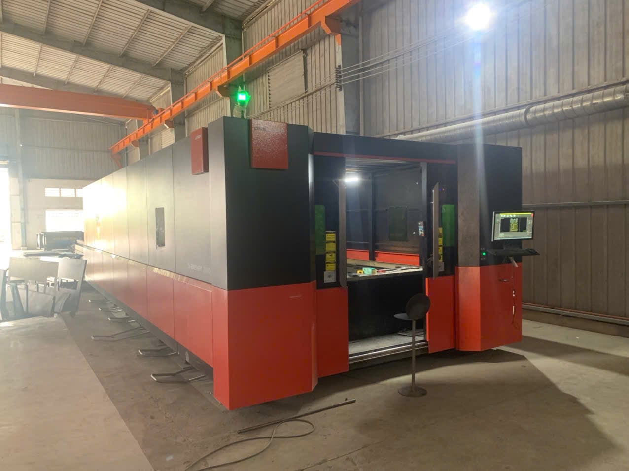 Laser cutting machine running sheet stock at Viet Laser, a DEWIN-verified Vietnamese supplier facility