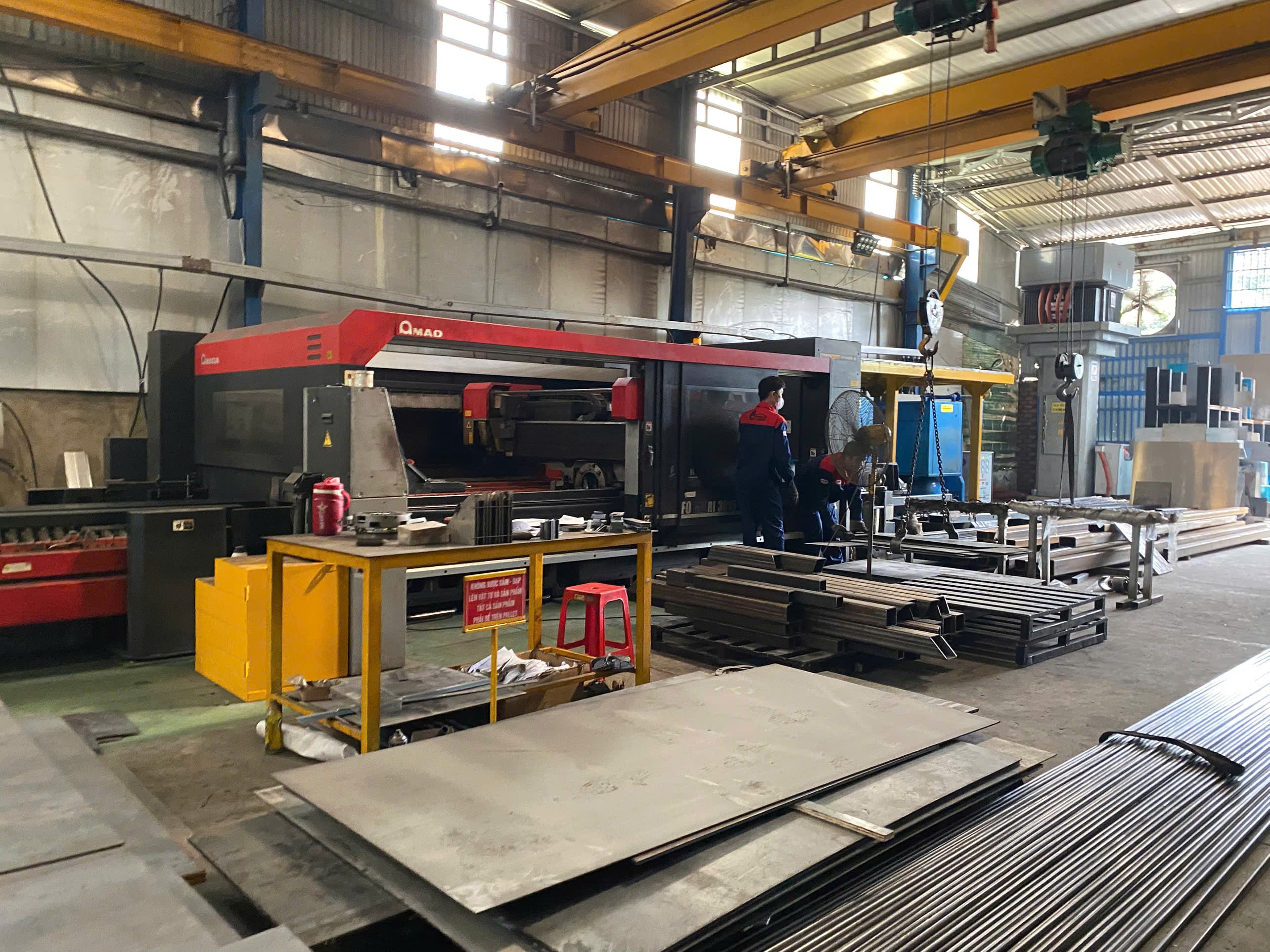 Laser cutting machine running sheet stock at Ntp Group, a DEWIN-verified Vietnamese supplier facility