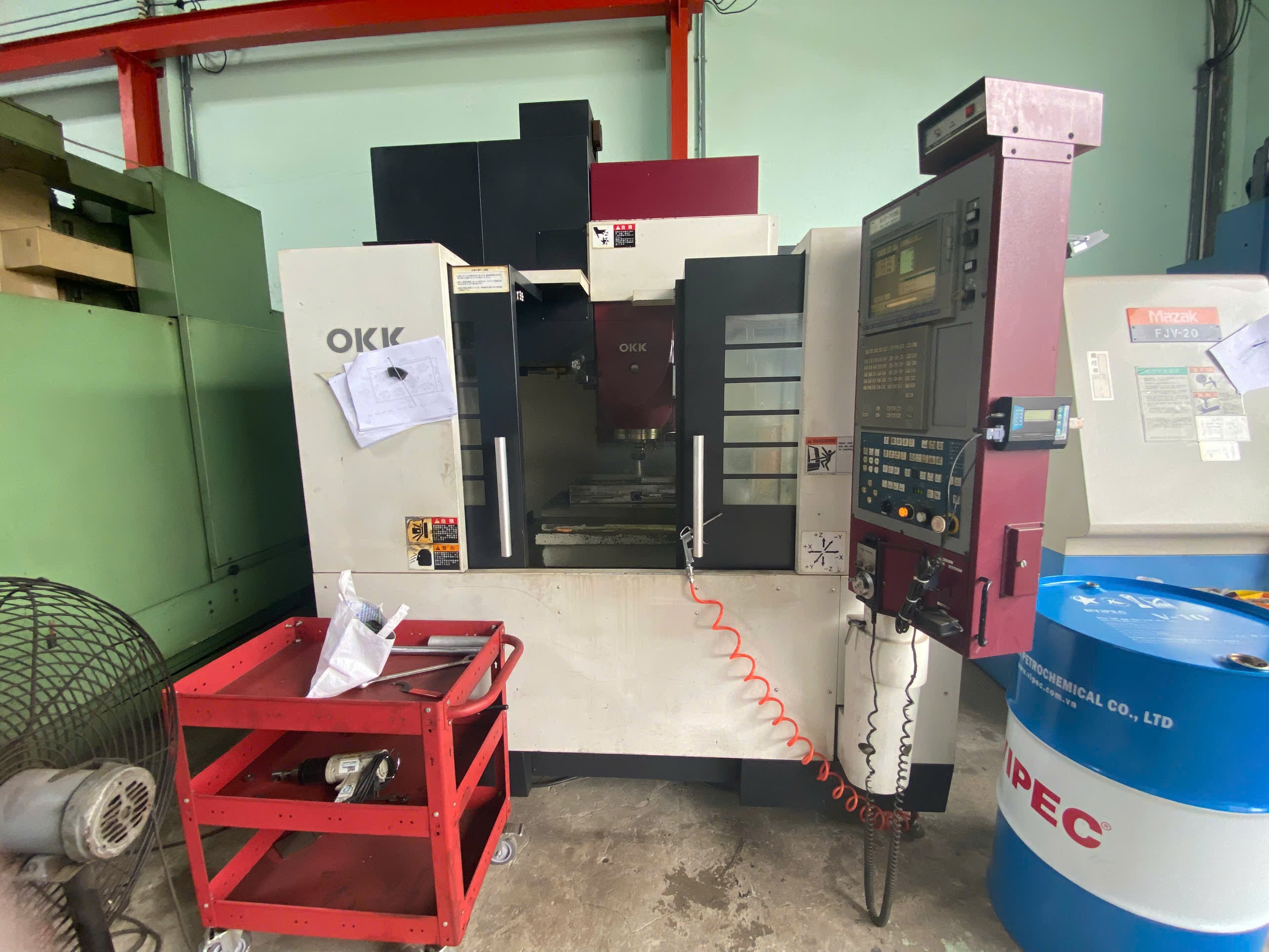 CNC milling machine cutting a part at Gia Phat Mold Mechanical Production Trading, a DEWIN-verified Vietnamese supplier facility