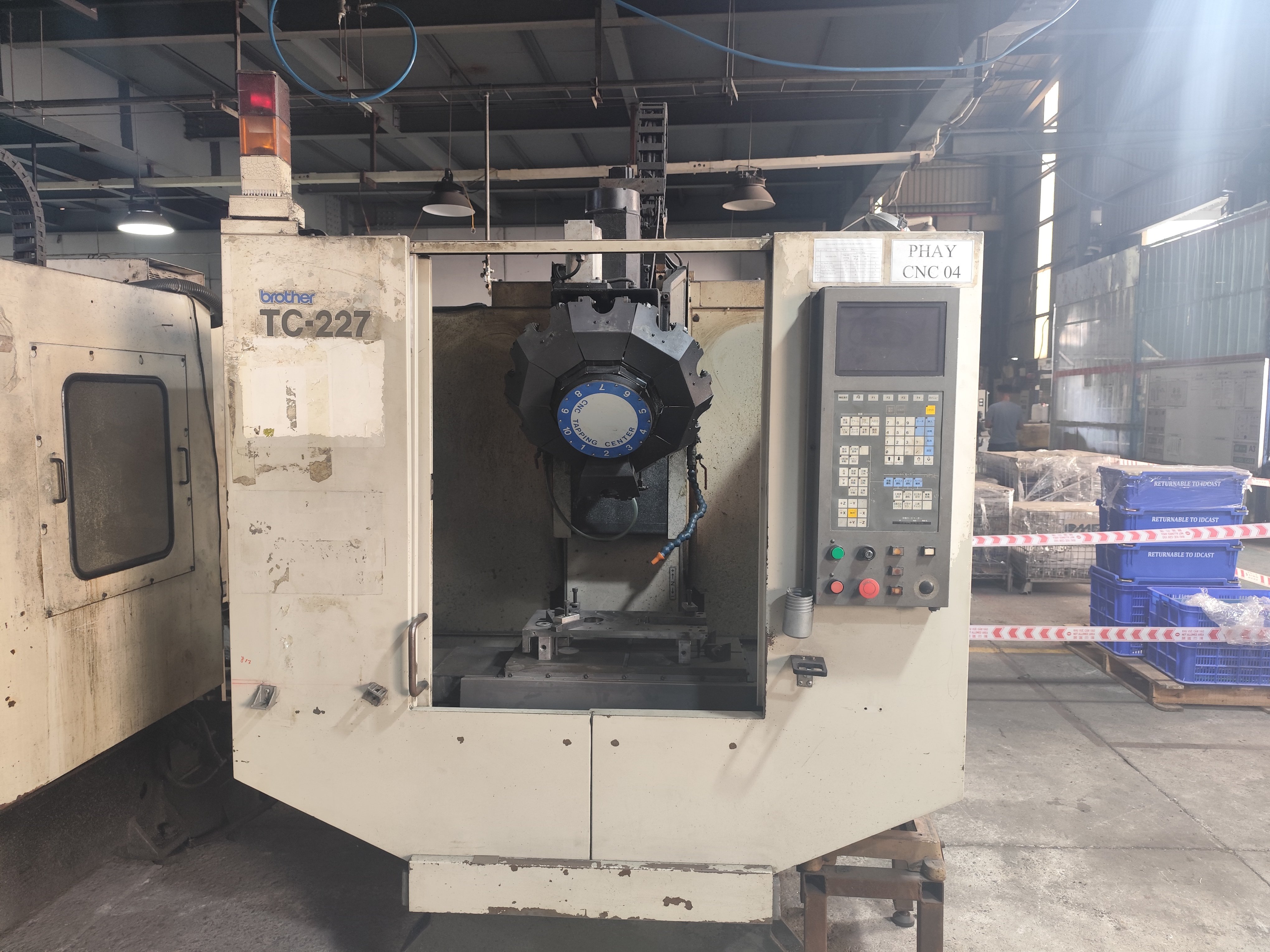 CNC milling machine cutting a part at Industrial Mechanics And Automation, a DEWIN-verified Vietnamese supplier facility