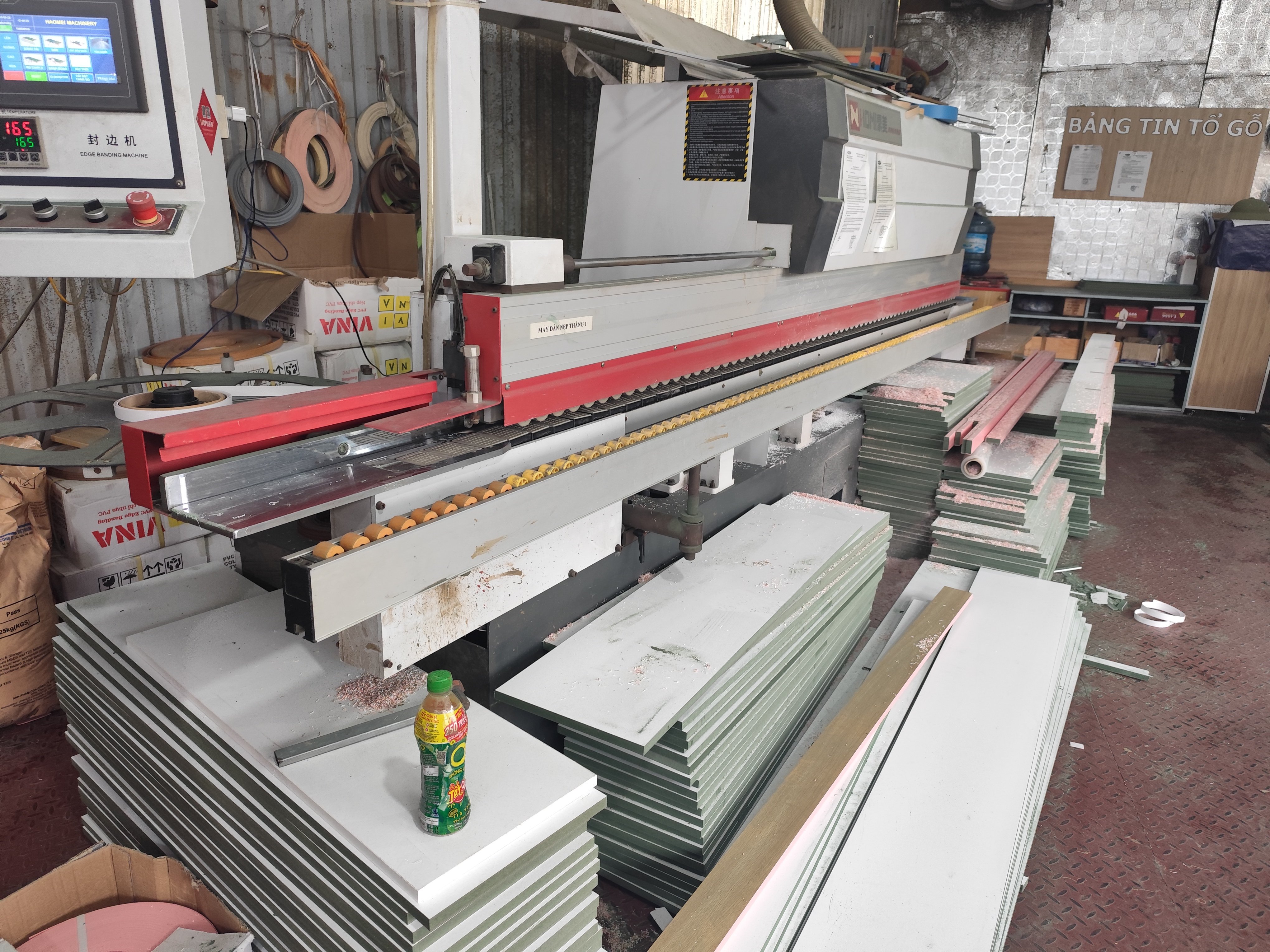 Laser cutting machine running sheet stock at One Tech Production and Trading, a DEWIN-verified Vietnamese supplier facility