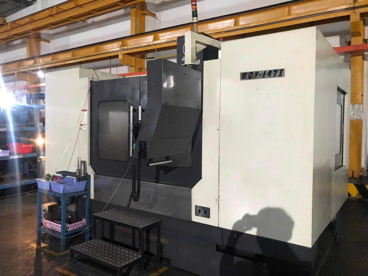 CNC milling machine cutting a part at Tan Lap Thanh plastic company, a DEWIN-verified Vietnamese supplier facility